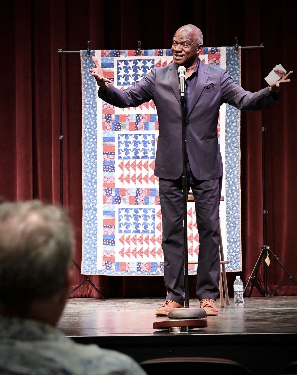 Michael Brundy emceeing on stage at the National Storytelling Network Conference