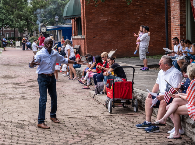 Michael speaking to a large audience